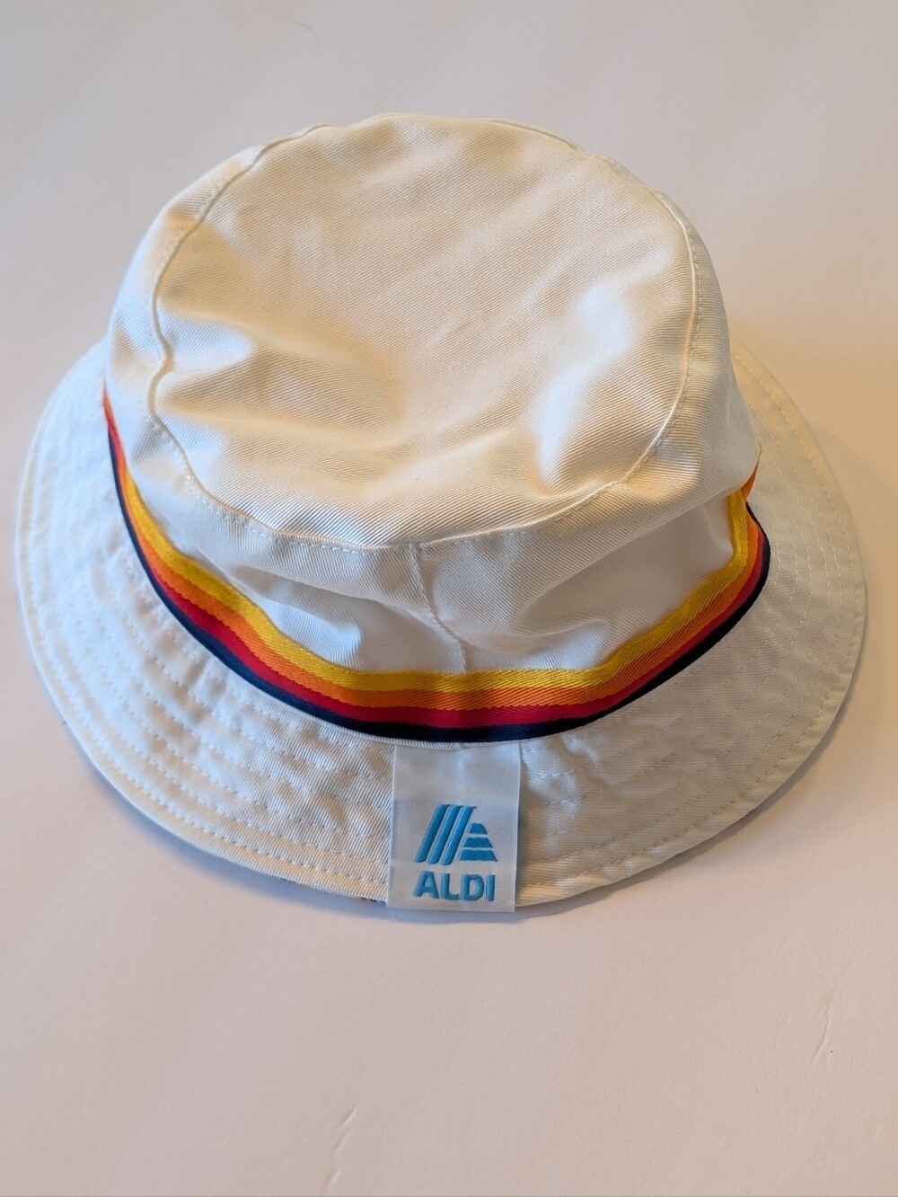 ALDI White Bucket Hat with Rainbow Stripe
